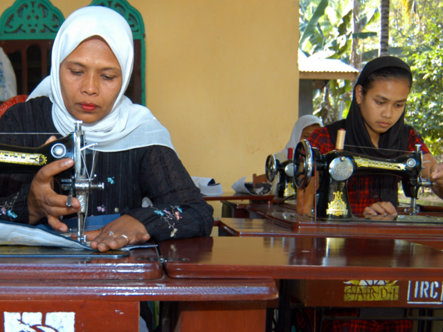 Asnidar (on the left) and Yusnandi are tailors in the village of Pante Gura, Aceh province in western Indonesia—and are some of the main providers of clothes in the village. 