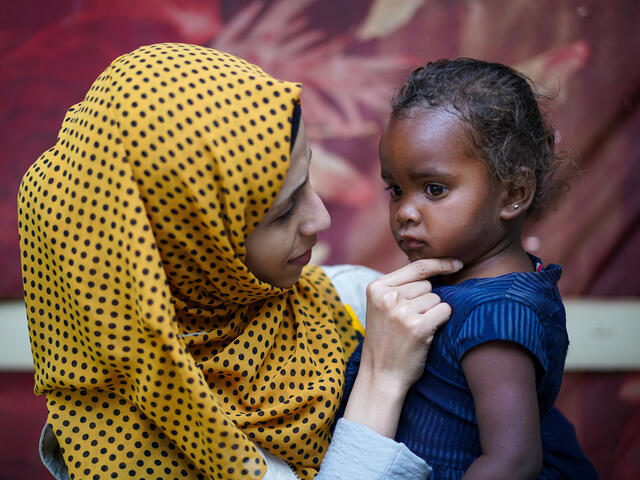 Dr. Shahira conducts a follow-up checkup on three-year-old Enqath.