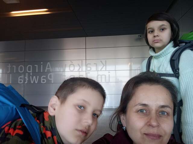 Halyna and her children before boarding their flight to the UK