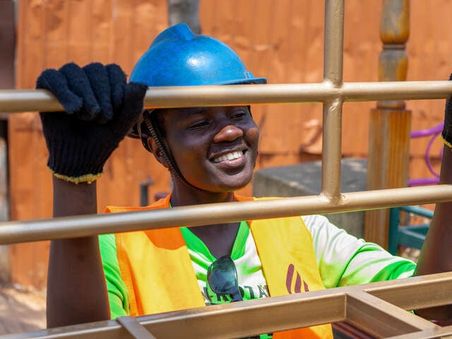 Rahma, 24, shows a piece of furniture she has constructed in Kampala, Uganda.