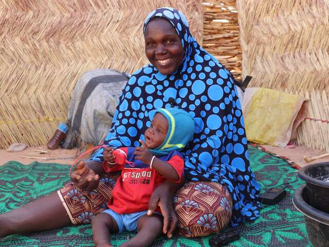 From the Ouallam site in Niger, Domo (35) poses with her son Ichaou.