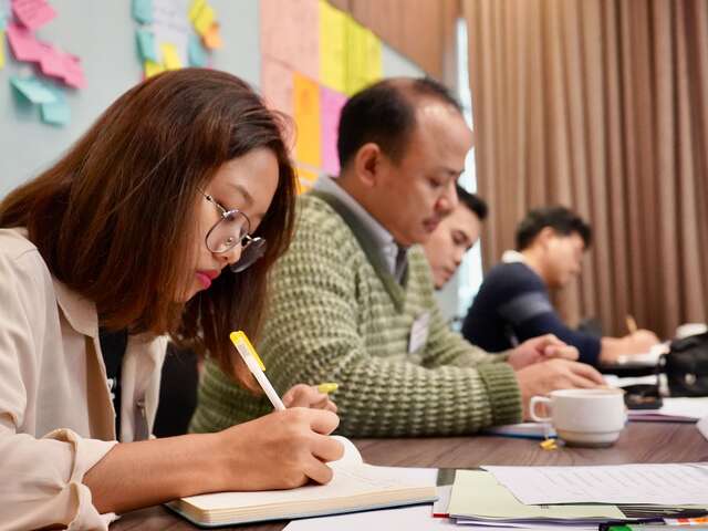 One of the training participants is practicing different questioning techniques to enhance communication skills essential for advocacy and community engagement.