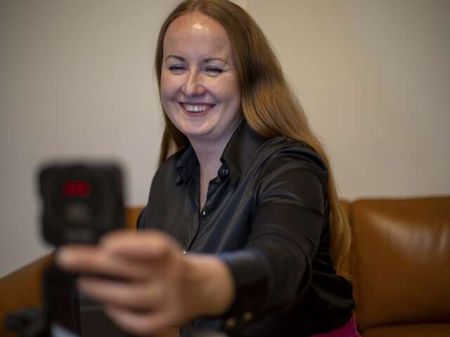 Svitlana records a new video for her social media channels.