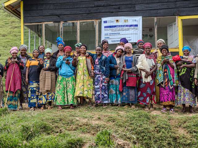 Imani with her all-women support system outside the EU-funded community center. 