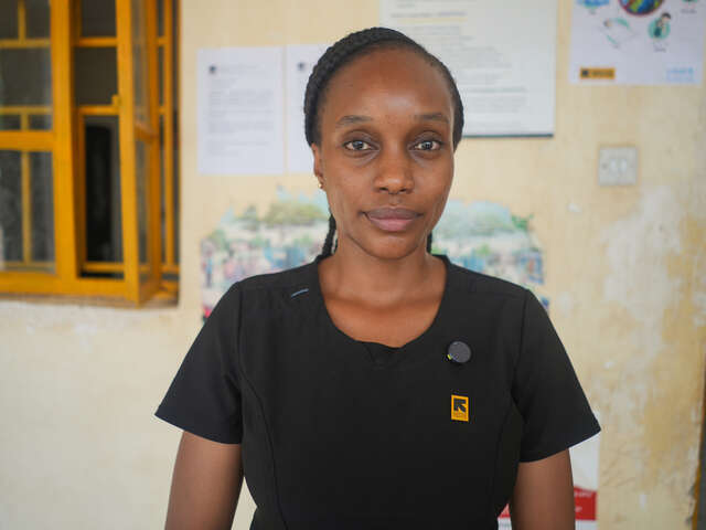 IRC Health Manager Dr. Sila Mothe poses in front of IRC-run Amusait Hospital.