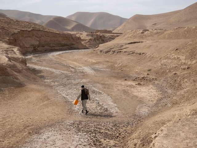 Muhammad Sadiq walks to find water.