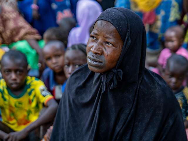 Woman wearing a long black veil