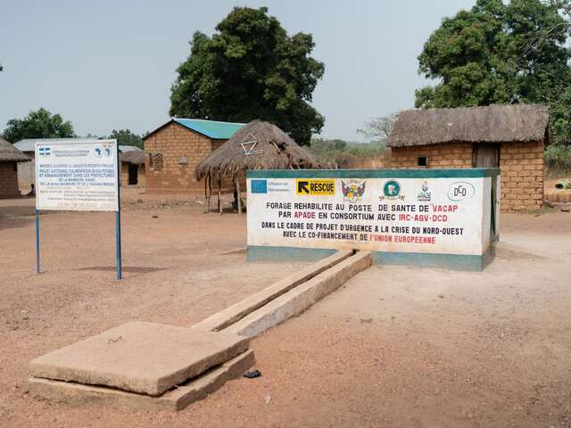 A sign at the well, stating that it has been made with IRC and EU support.