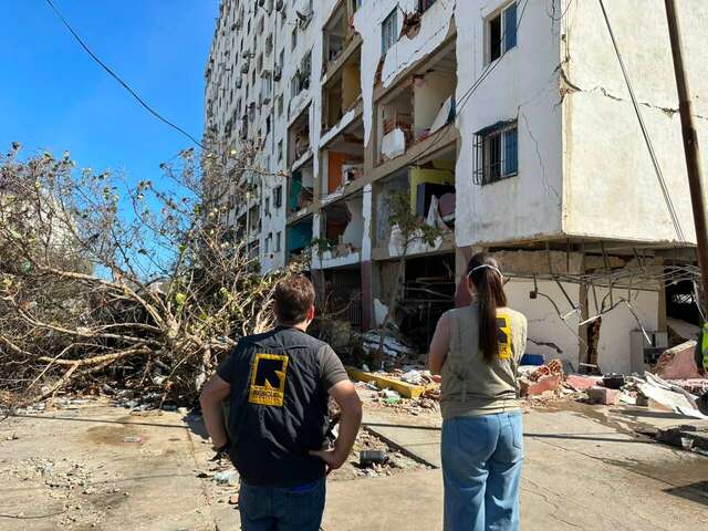 IRC staff members in La Guaira survey the destruction of the twin earthquakes on June 24.
