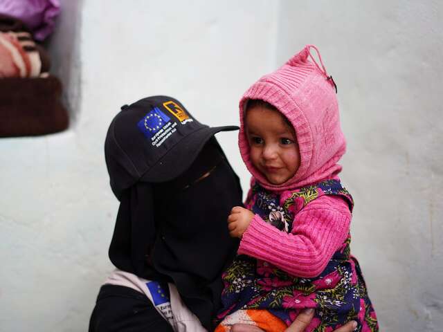 Ashwaq holding one-year-old Khulood