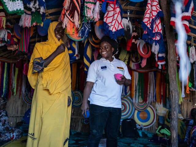 Bebata and Fati, an expert weaver, conduct a session on weaving for the women at the center, and Bebata shows the women how to lactate.