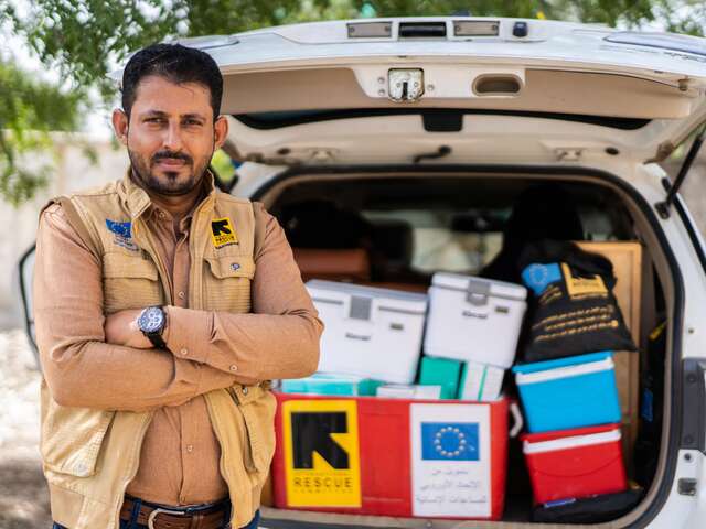 Dr Marwan in front of the mobile health clinic truck 