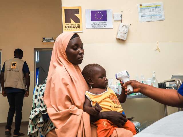 A mother and child come in for a checkup at the IRC hospital.