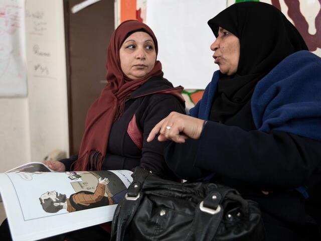 Women discuss the different options that Hala has when she comes across risks on her way to work.
