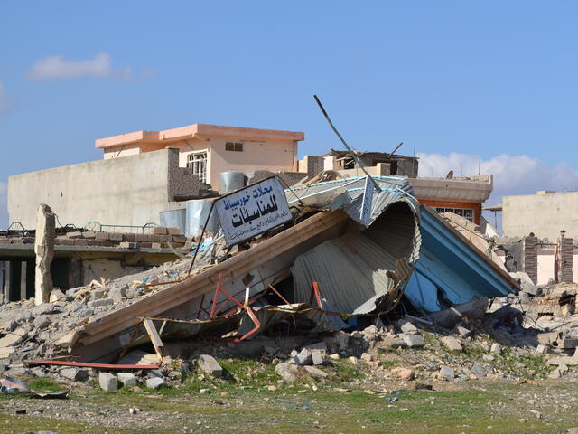 The collapsed ruins of  a shop in Khorsebat, a village that was heavily damaged during the battle to retake the nearby city of Mosul from ISIS 