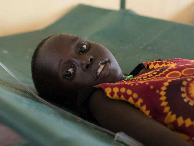A young girl recovers on an intravenous drip at the International Rescue Committee's cholera treatment centre in Kakuma refugee camp in northern Kenya. She and her family arrived at the camp in May 2017 after fleeing violence in neighboring South Sudan.