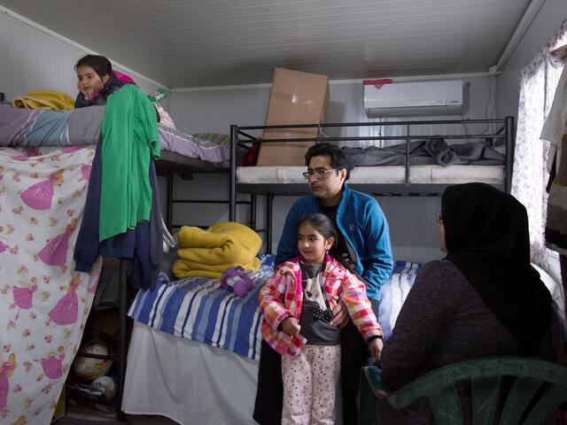 A family sit in their ISO Box