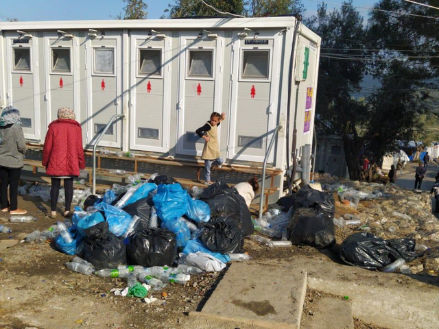 Rubbish piles up around the toilets in Moria reception centre