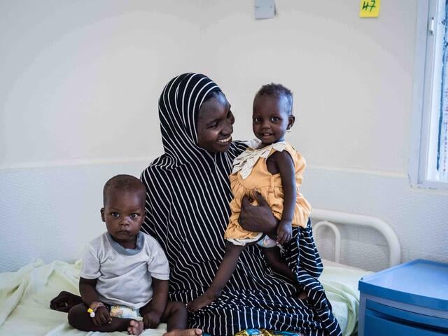 Aisha and her daughter Aisha sit in the IRC's clinic in northeast Nigeria.