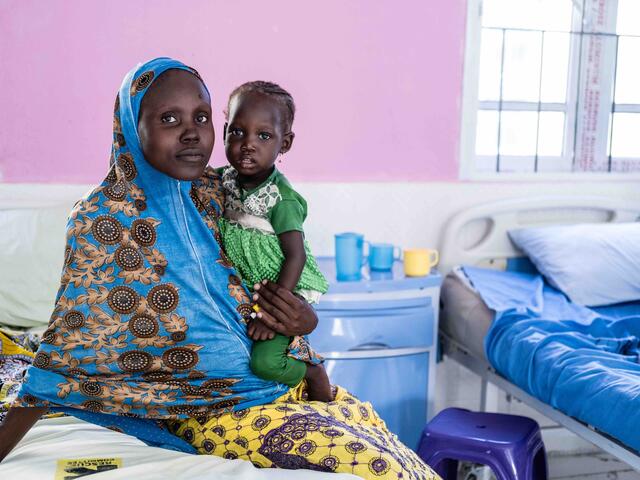 Aisha and her daughter Aisha sit in the IRC's clinic in northeast Nigeria.