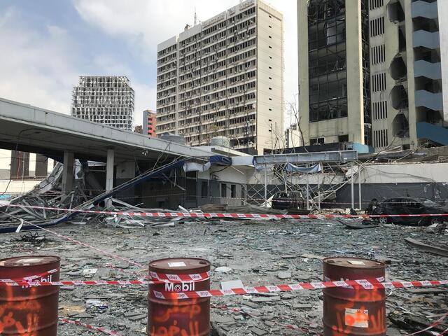 Damaged bridge and buildings in beirut.