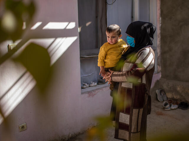 Zulaykha holds her youngest child.