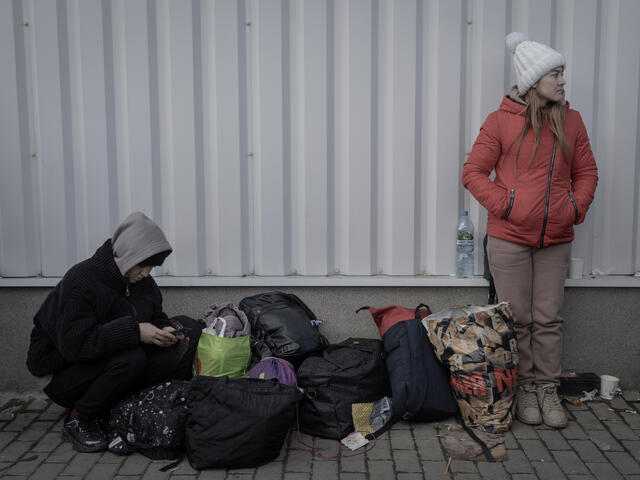 Ukrainian refugees gather at Przemysl railway station. 