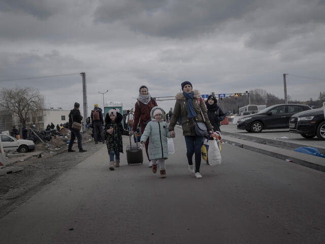 A Ukrainian refugee family gather at Przemysl railway station.