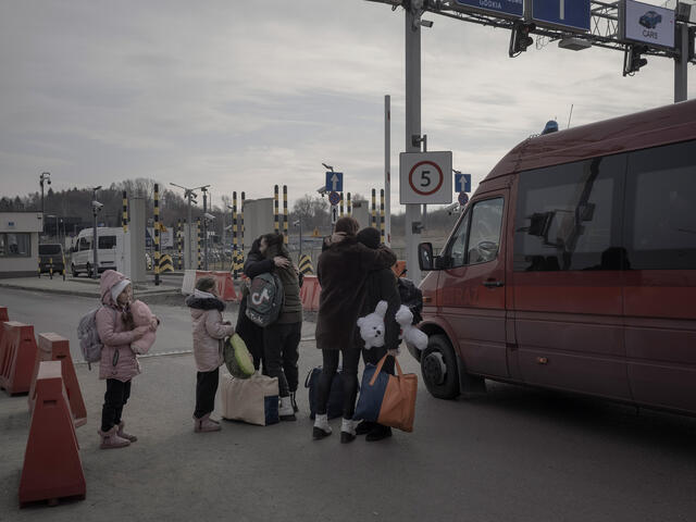 A family meets at the border crossing point of Medyka, Poland.