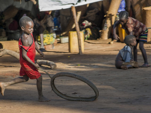 A boy plays in a makeshift camp in Kaga Bandoro