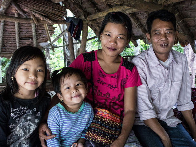 Bar Mee, her husband Tin Win, and their two daughters at Mae La refugee camp on the Thailand-Myanmar border.