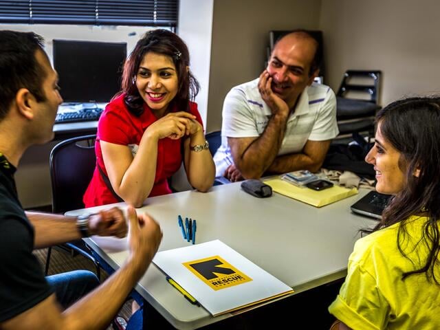 IRC staff help clients prepare resumes in Economic Empowerment.