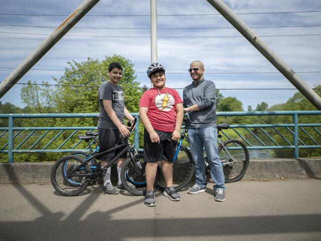 Yousif rides his bike with his brother, Ali and father in Seattle