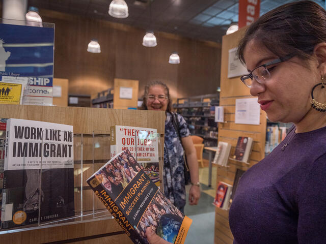Salvadoran mom and daughter at local book store in San Jose