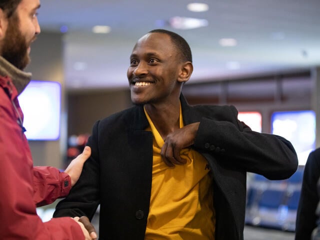 Divin, 28, a refugee from the Democratic Republic of Congo, waits for his in-laws to arrive at Boise Airport.