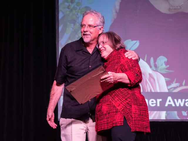 Volunteer Janet Ellingson, receives a Rescue Partner Award at the International Rescue Committee in Salt Lake City's annual Breaking Bread