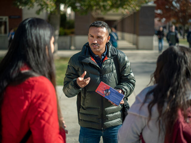 Tecle, an International Rescue Committee staff member, speaks to students at Boise State University