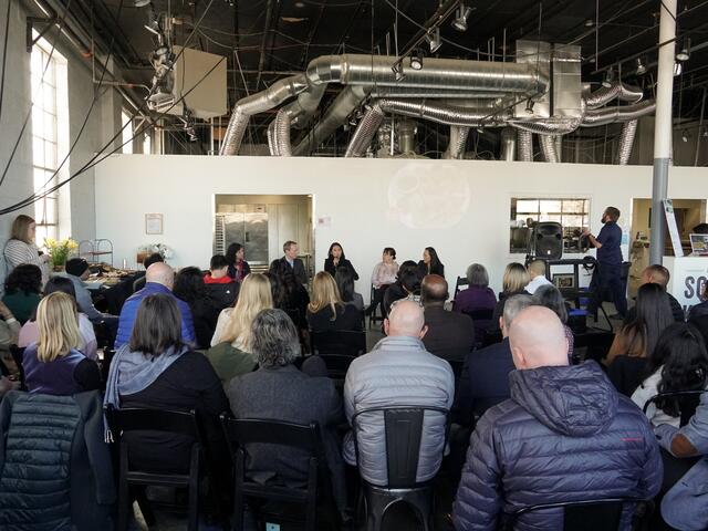 Group gathering to meet in a warehouse in Salt Lake City.