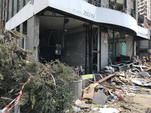 Street-level view of debris and damage to a building in Beirut, Lebanon after the August 4, 2020 explosion  