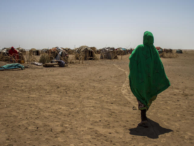 Sada Mohammed, 30, walks back to her shelter over parched earth after being displaced by a drought in Ethiopia in 2016.