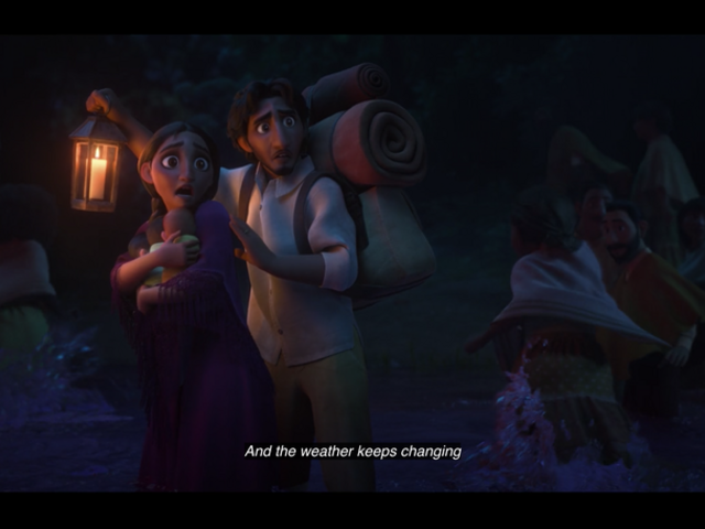 Standing in a river, young Alma holds her triplets while Pedro holds a lantern and carries their belongings on his back. They are looking at something off camera, terrified, and other people are fleeing alongsie them. 