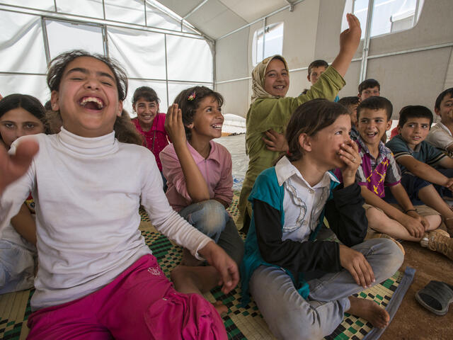 Children in a makeshift school in Idlib, Syria