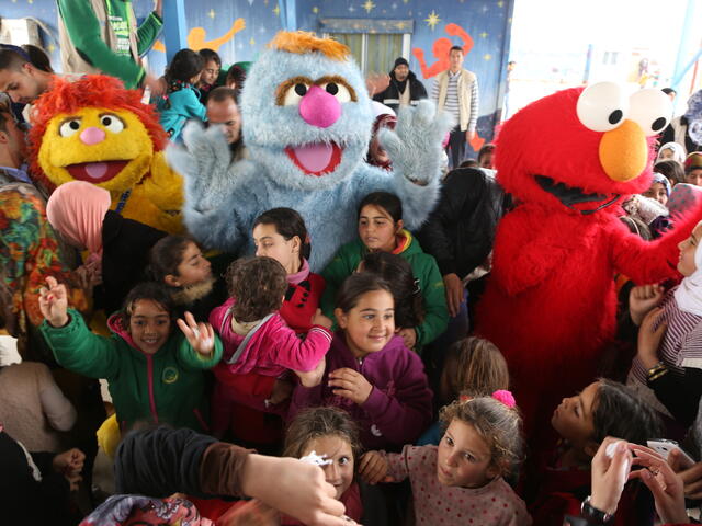 Syrian children in Jordan's Zaatari refugee camp enjoy a visit from the Muppets