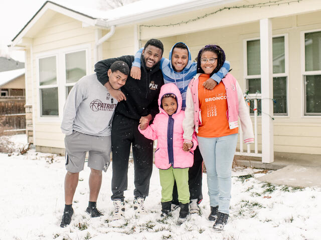 The Ngalamulume siblings in front of their home in Boise, Idaho.
