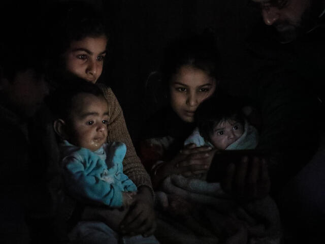 Young girls soothe babies sheltering underground in Eastern Ghouta.