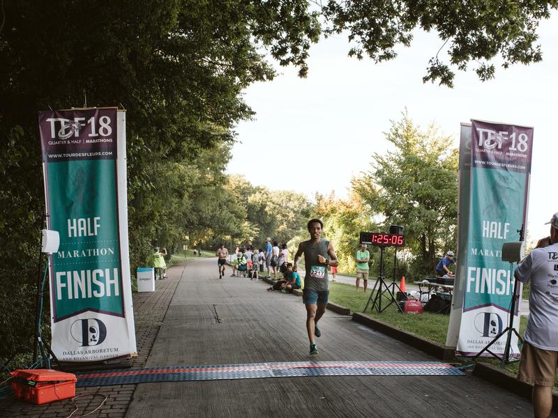 Ethiopian runner Tolassa Elemaa crosses the finish line of a half marathon in Dallas, Texas