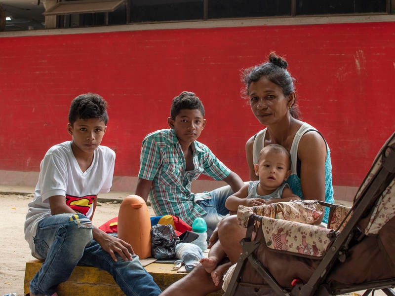 A Venezuelan mother and her three children living on the street in Bogota, Colombia