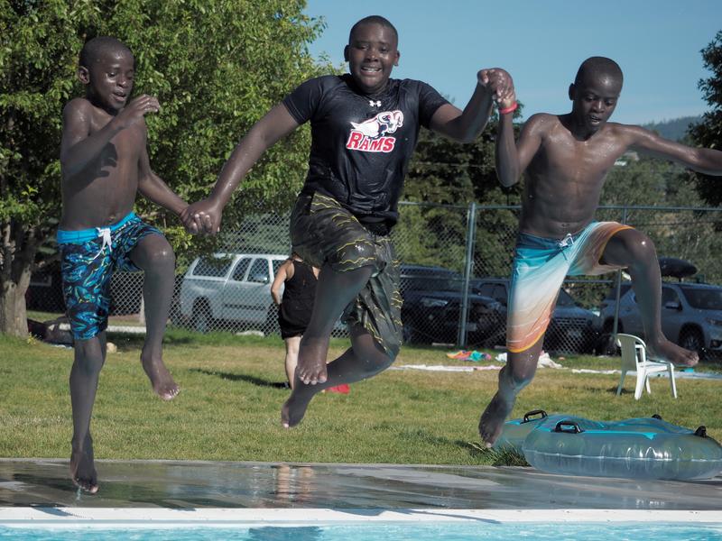 Kenedy, Wakati, and Enoki enjoy the water.