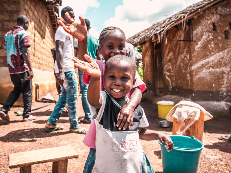 Children in Monleu Ivorian children wash their hands