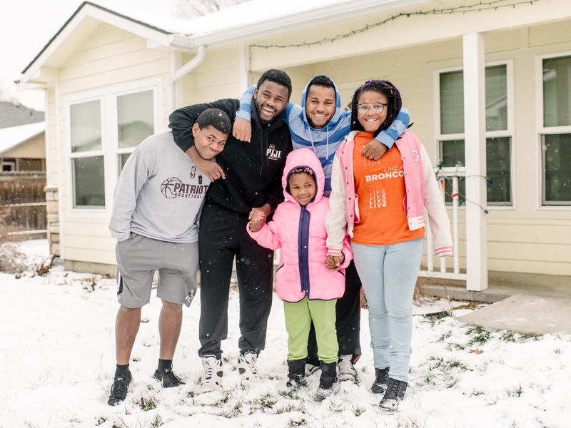 The Ngalamulume siblings in front of their home in Boise, Idaho.